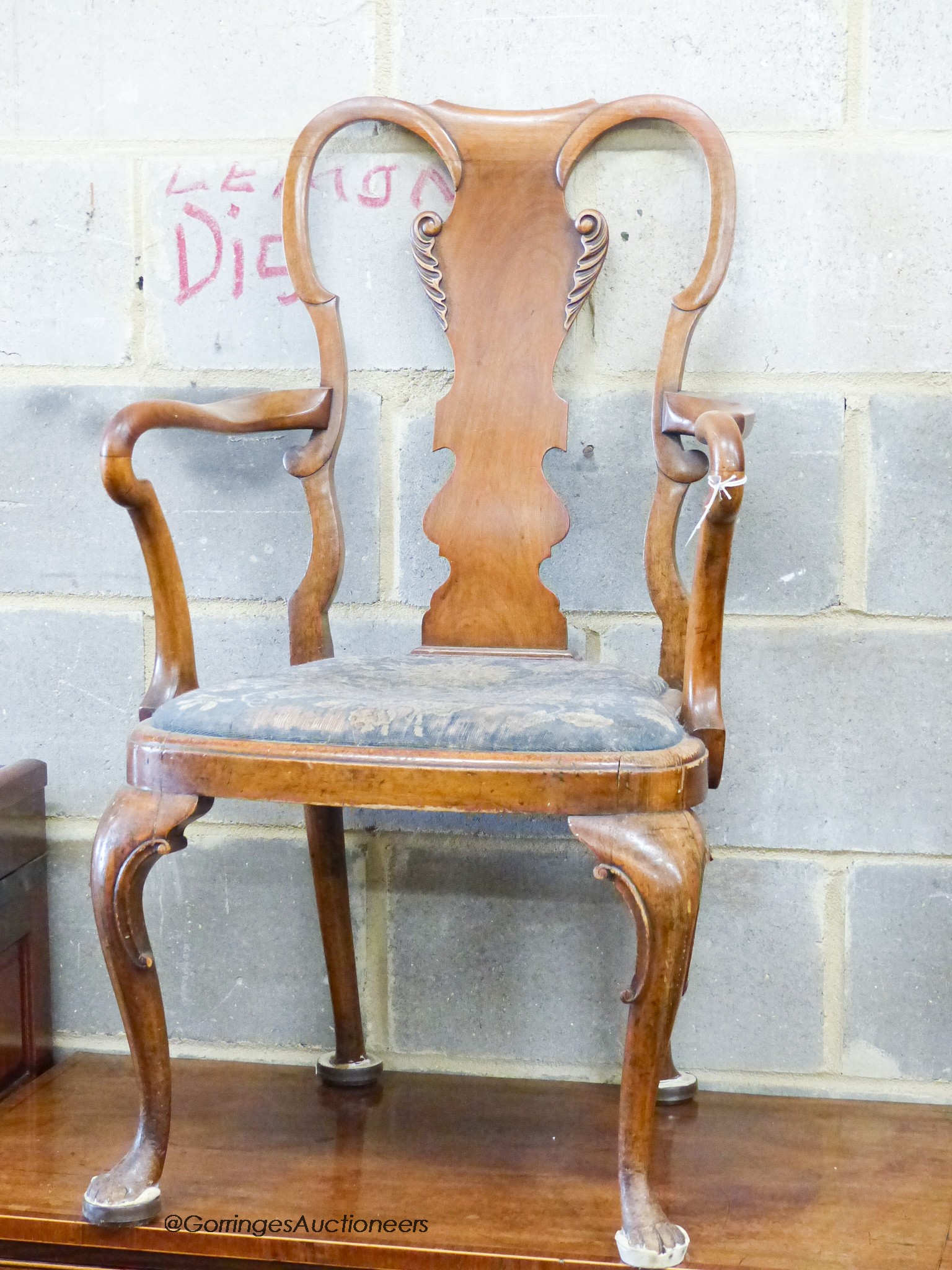 A Queen Anne revival walnut elbow chair